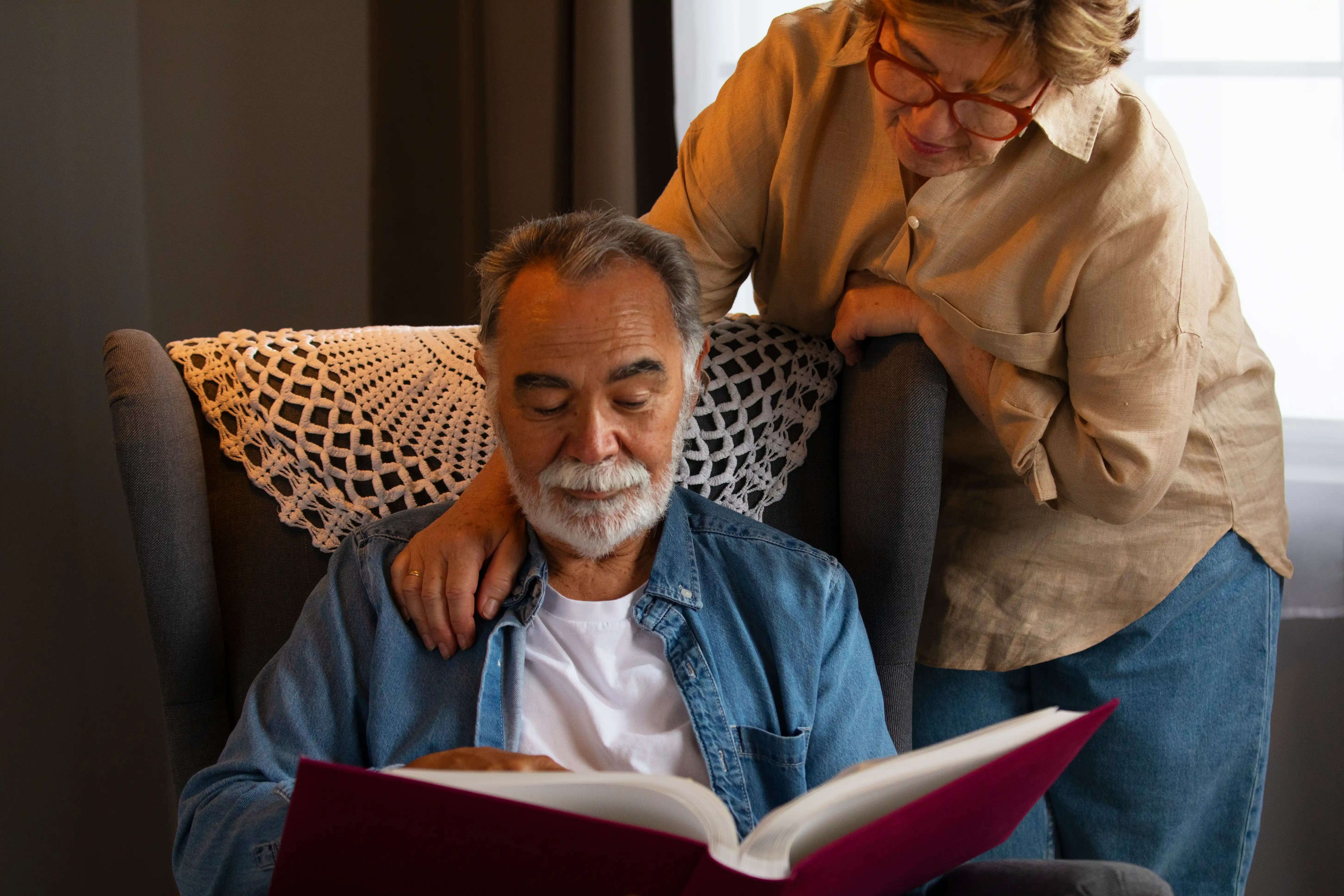 Caregiver holding a resident's hands